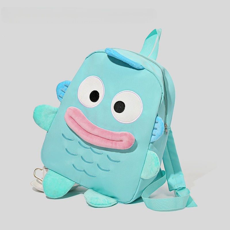 The Seakoff Adorable Clownfish Backpack for Kids boasts a fun, underwater-themed fish design in light blue with cartoon eyes, a smiling mouth, and fins. Featuring adjustable straps and a spacious main compartment, it&