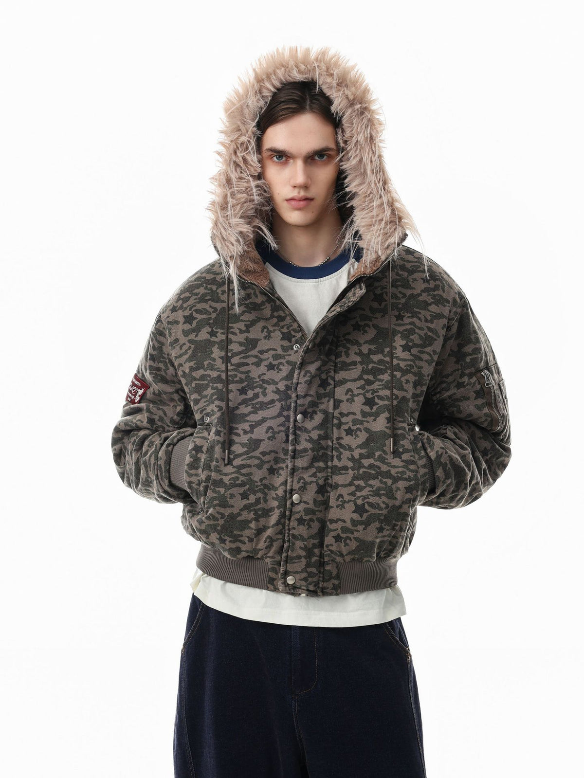 Oversized star camouflage padded bomber jacket with faux fur-trimmed hood, snap-button placket, and sleeve utility pocket