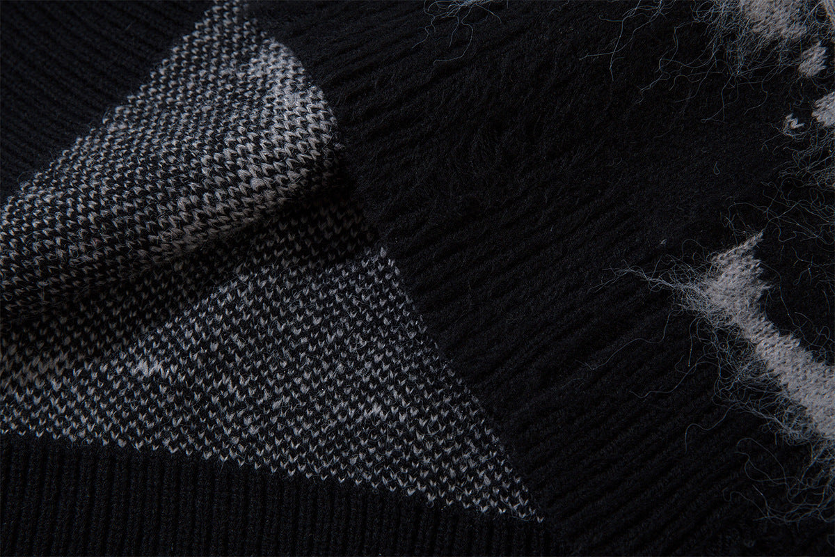 Close-up of the black ribbed collar seam and reverse knit structure inside the sweater
