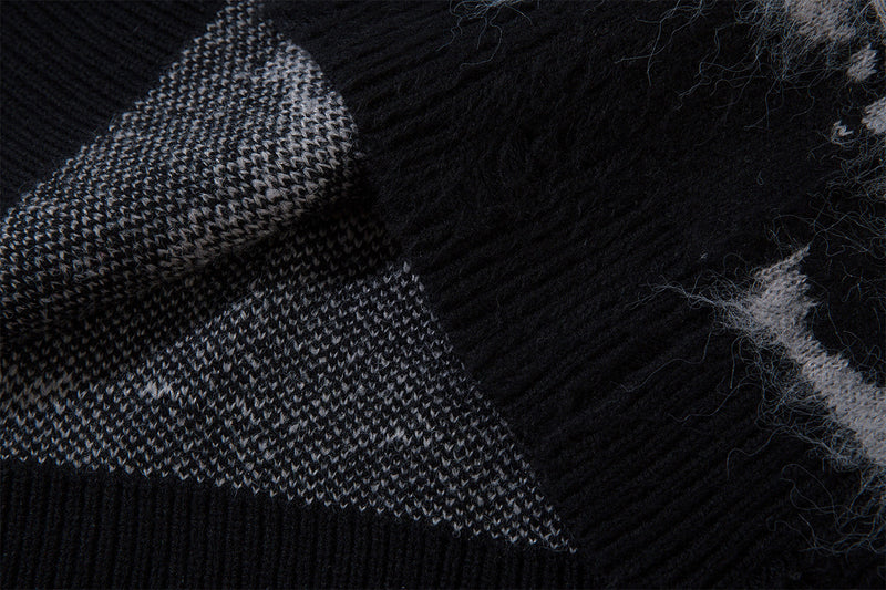 Close-up of the black ribbed collar seam and reverse knit structure inside the sweater
