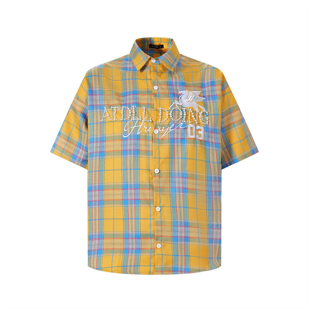 Oversized plaid short-sleeve shirt with Pegasus embroidery and pearl-stud lettering in yellow tartan colorway