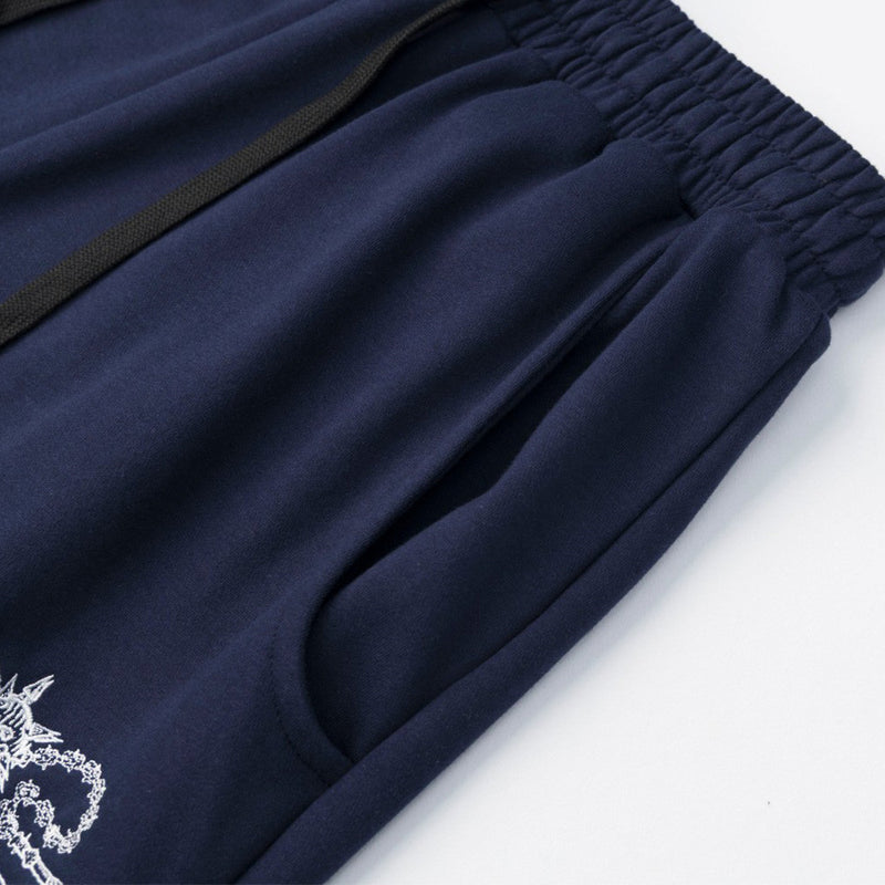 Pantalon de survêtement homme à jambes larges avec écusson brodé et imprimé graphique en écriture