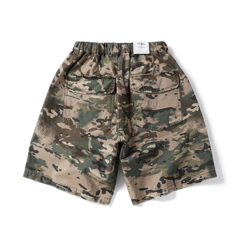Camouflage cargo shorts with back pockets and elastic waistband, back view