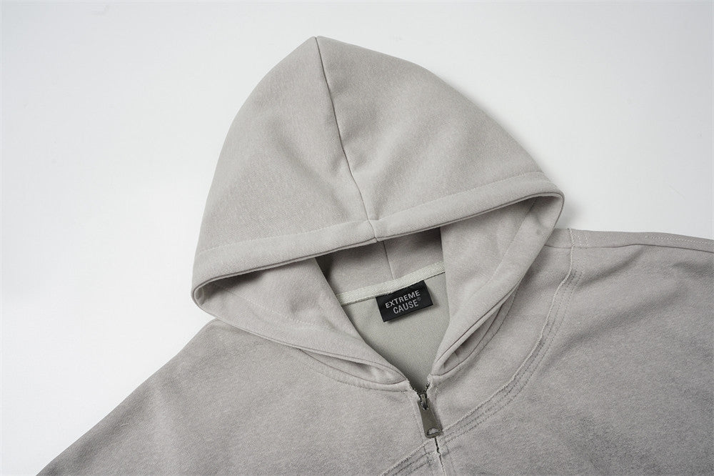 Sweat à capuche oversize zippé – Finition délavée usée, poches à multiples zips et bords bruts