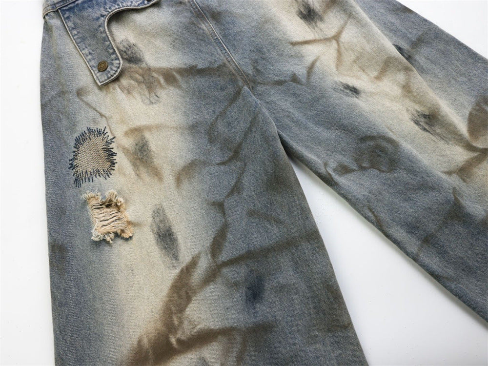 Baggy Wide-Leg Jeans – Chaotic Embroidery, Distressed Denim & Arc-Hem Design