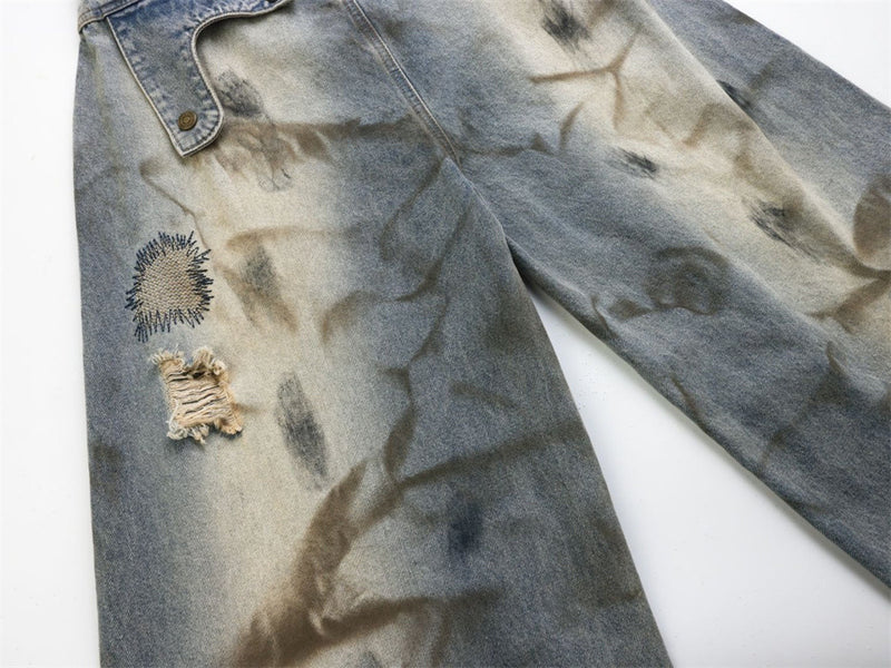 Baggy Wide-Leg Jeans – Chaotic Embroidery, Distressed Denim & Arc-Hem Design