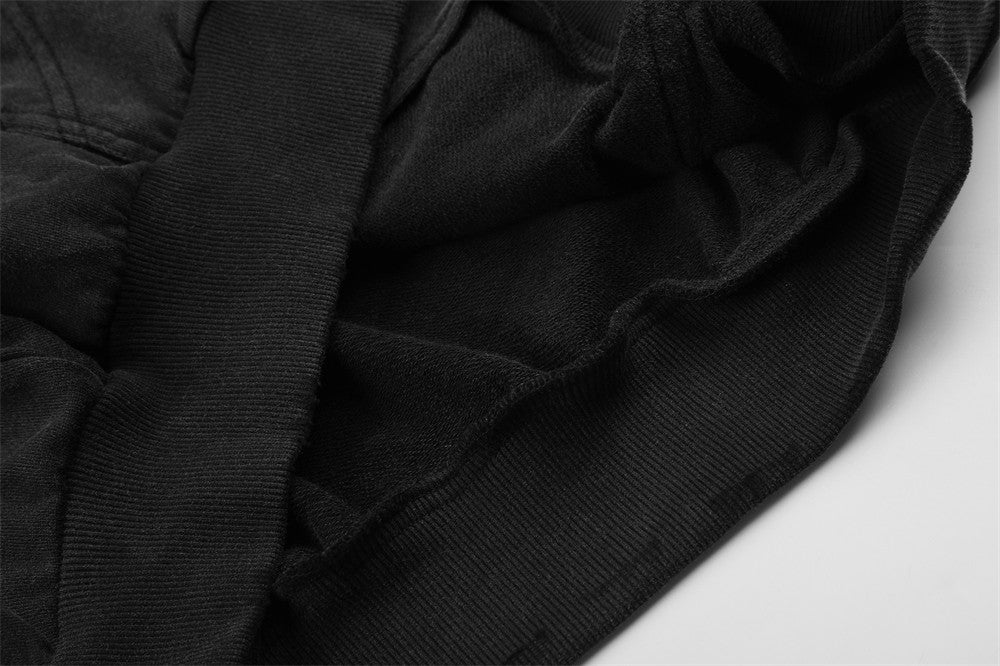 Close-up of black fleece hoodie interior and ribbed trim