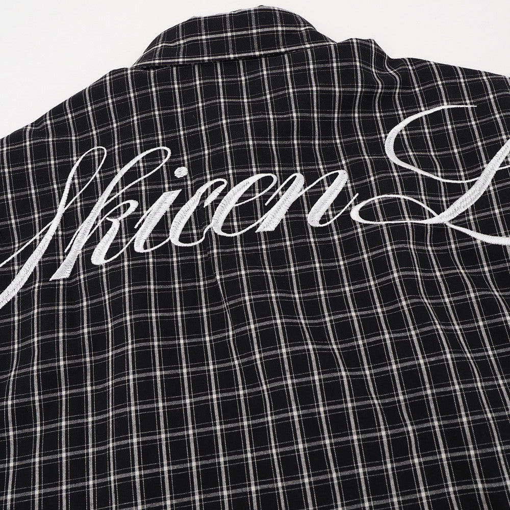 Black plaid shirt back yoke with white Gothic script print