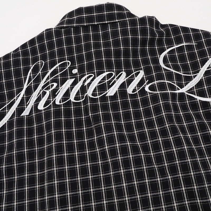 Black plaid shirt back yoke with white Gothic script print
