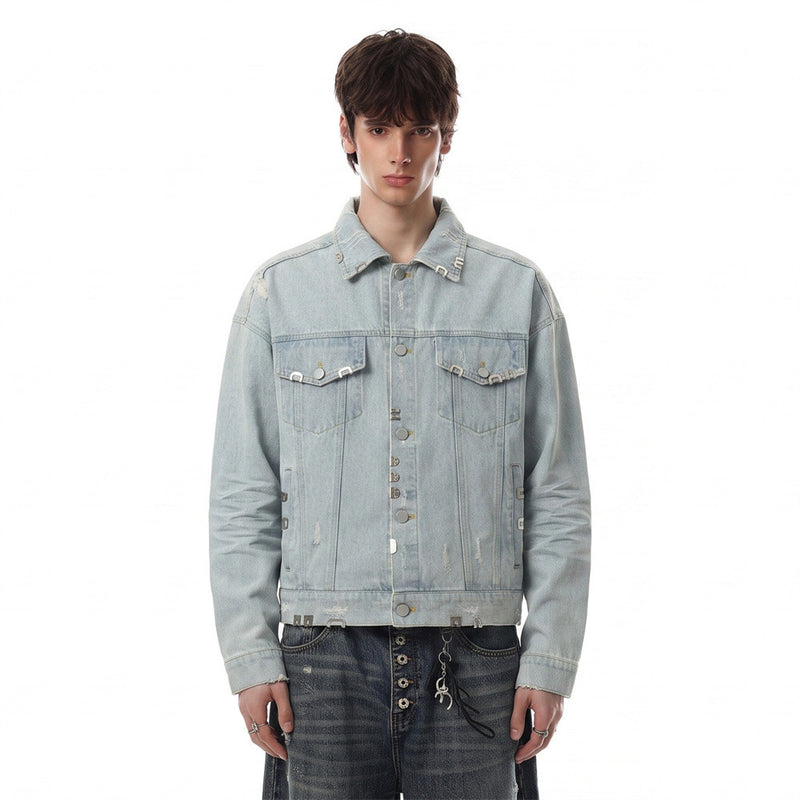 Model wearing a light wash distressed denim jacket with dual chest pockets and silver-tone hardware