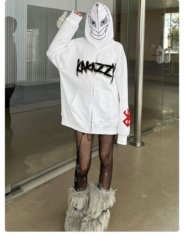 A person in a Berserk Griffith-Inspired Hoodie, featuring a face-covering mask design, stands by a modern glass entrance. Their black star-patterned sheer tights and gray furry boots complete an edgy look, perfect for any gathering of Berserk fans.