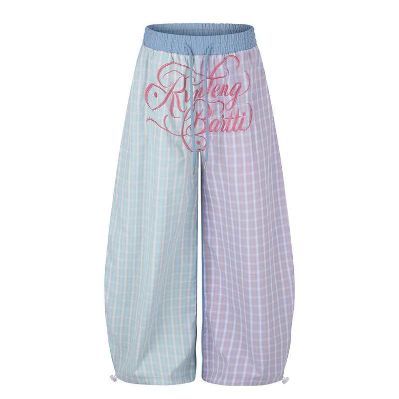 Colorblock pastel plaid wide-leg parachute pants with pink script embroidery on the front, featuring mint-blue and pink-laven