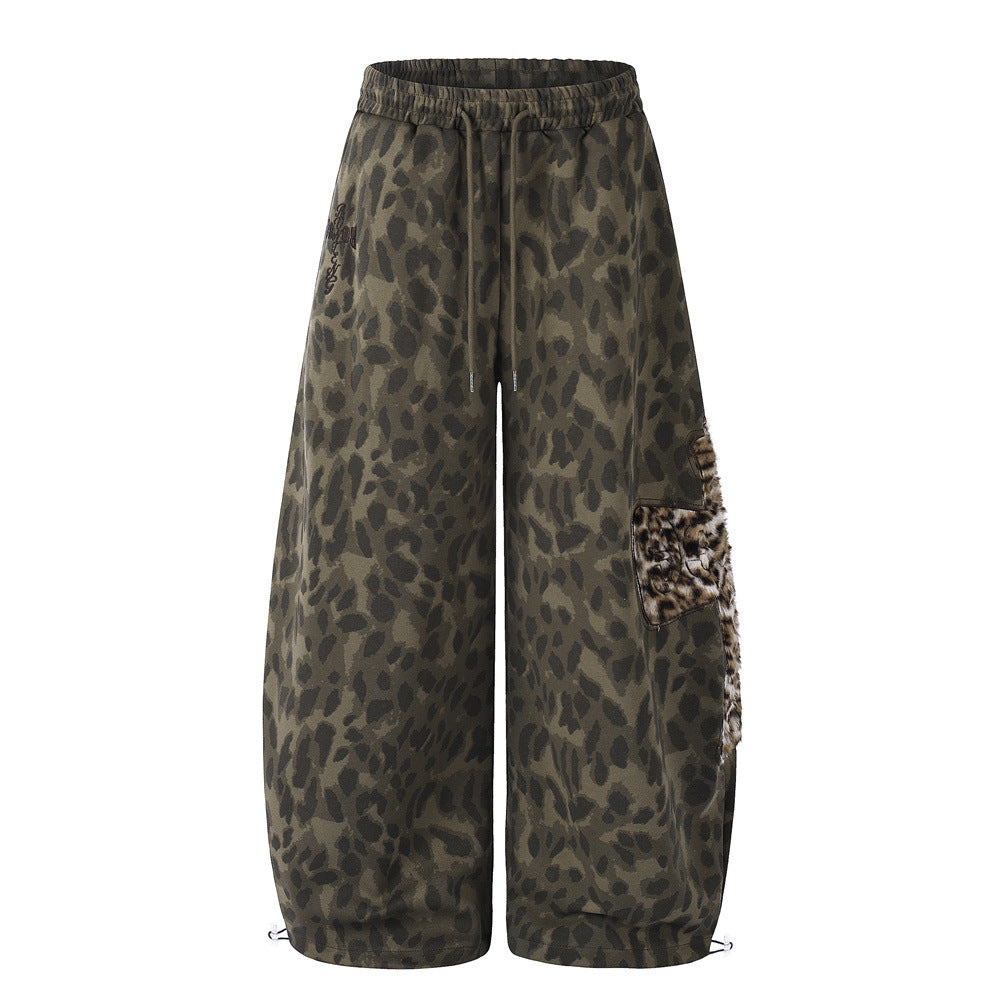 Men's wide-leg olive leopard print sweatpants with faux fur cargo pocket and adjustable hem toggles, front and back view