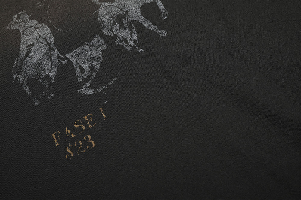 Close-up of lower front print with faded horse graphic and gold text on black shirt