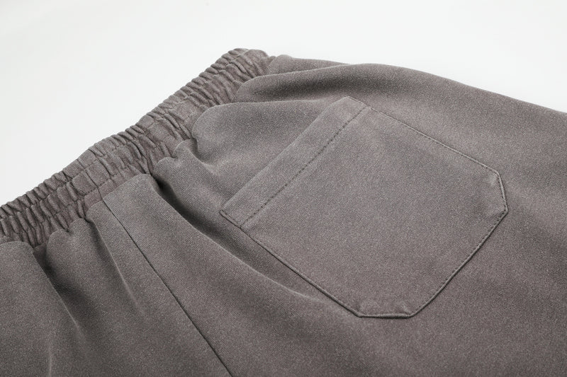 Pantalones de chándal de pierna ancha con cruz estampada y acabado lavado ácido