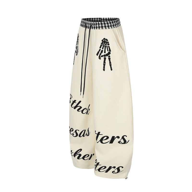 Pantalon de survêtement à jambes larges, imprimé main squelette et taille vichy