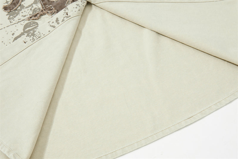 Close-up of cream shirt side seam and lower front panel