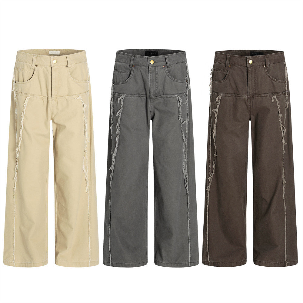 Men's wide-leg deconstructed trousers with frayed vertical seams in cocoa brown, front view