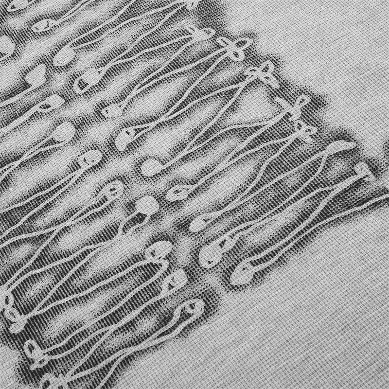Close-up of gray tee front graphic showing lace-up print detail on textured knit fabric