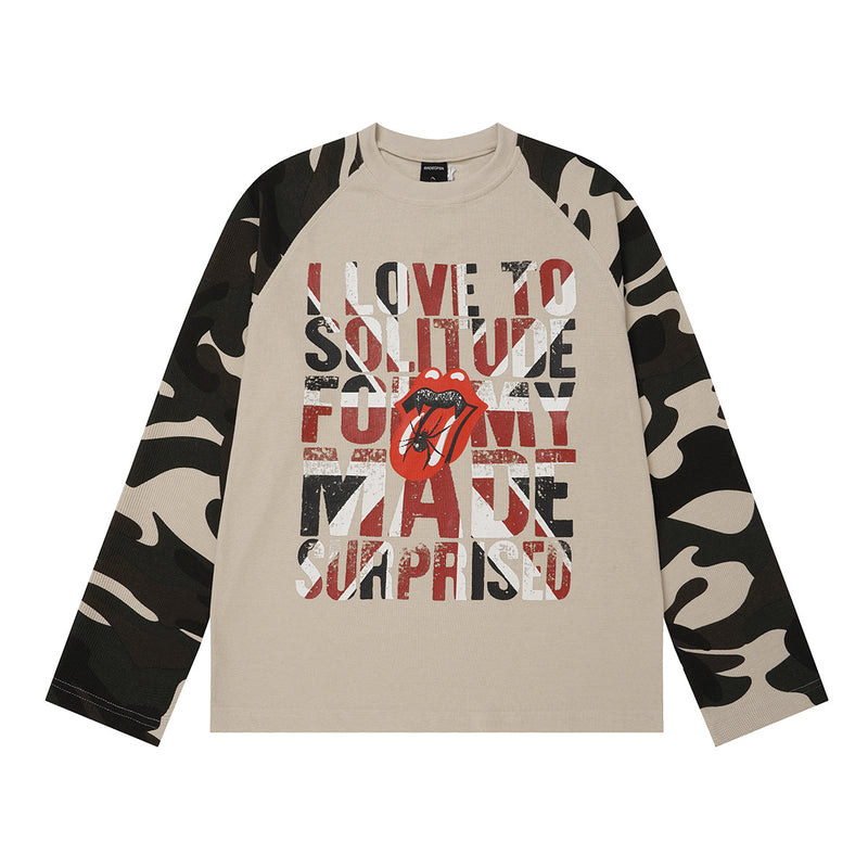 Oversized long-sleeve shirt with dark camo raglan sleeves and distressed vintage rock graphic print on beige waffle-knit body