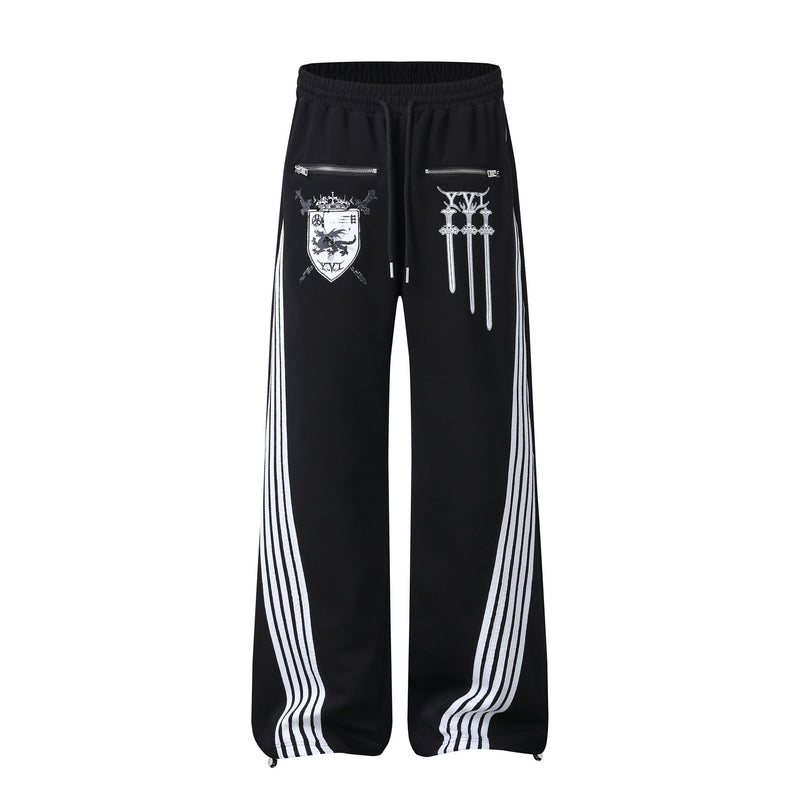 Pantalon de survêtement noir à jambes larges avec imprimé bouclier héraldique et empiècement latéral diagonal à rayures blanches multiples