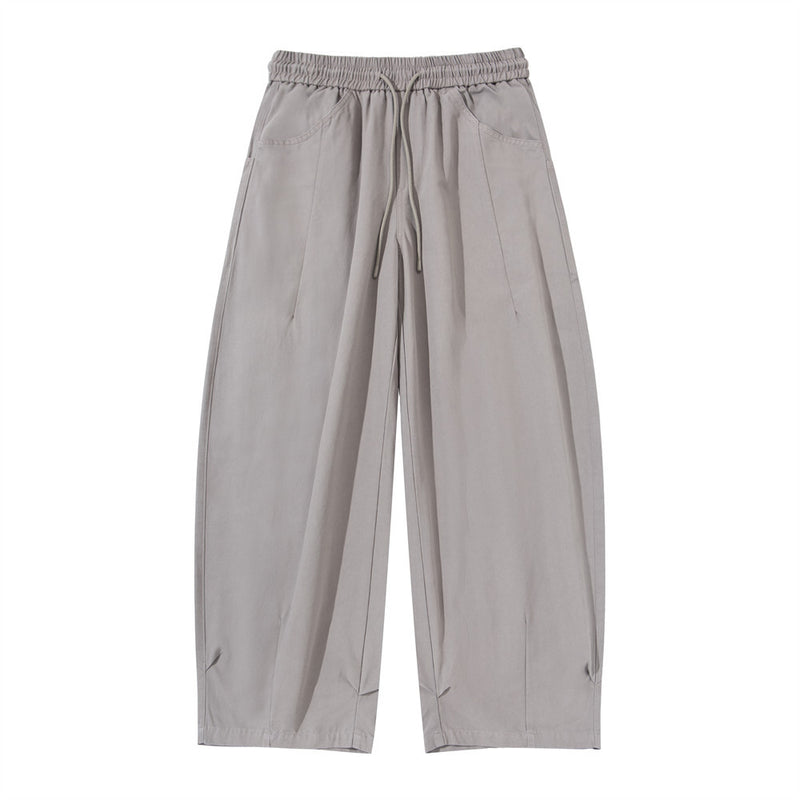 Men's wide leg cargo pants in light grey with elastic drawstring waist, front pleats, and patch pockets