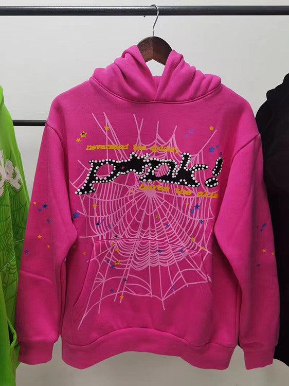 Introducing the Vibrant Pink Sp5der Hoodie by Sp5der: a standout streetwear sweatshirt featuring a spiderweb design, multicolored stars, and bold &quot;peek!&quot; graphics. Perfect for making a statement, it&