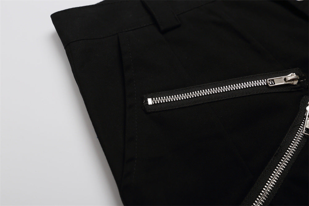 Close-up of black shorts side panel showing a horizontal zipper pocket