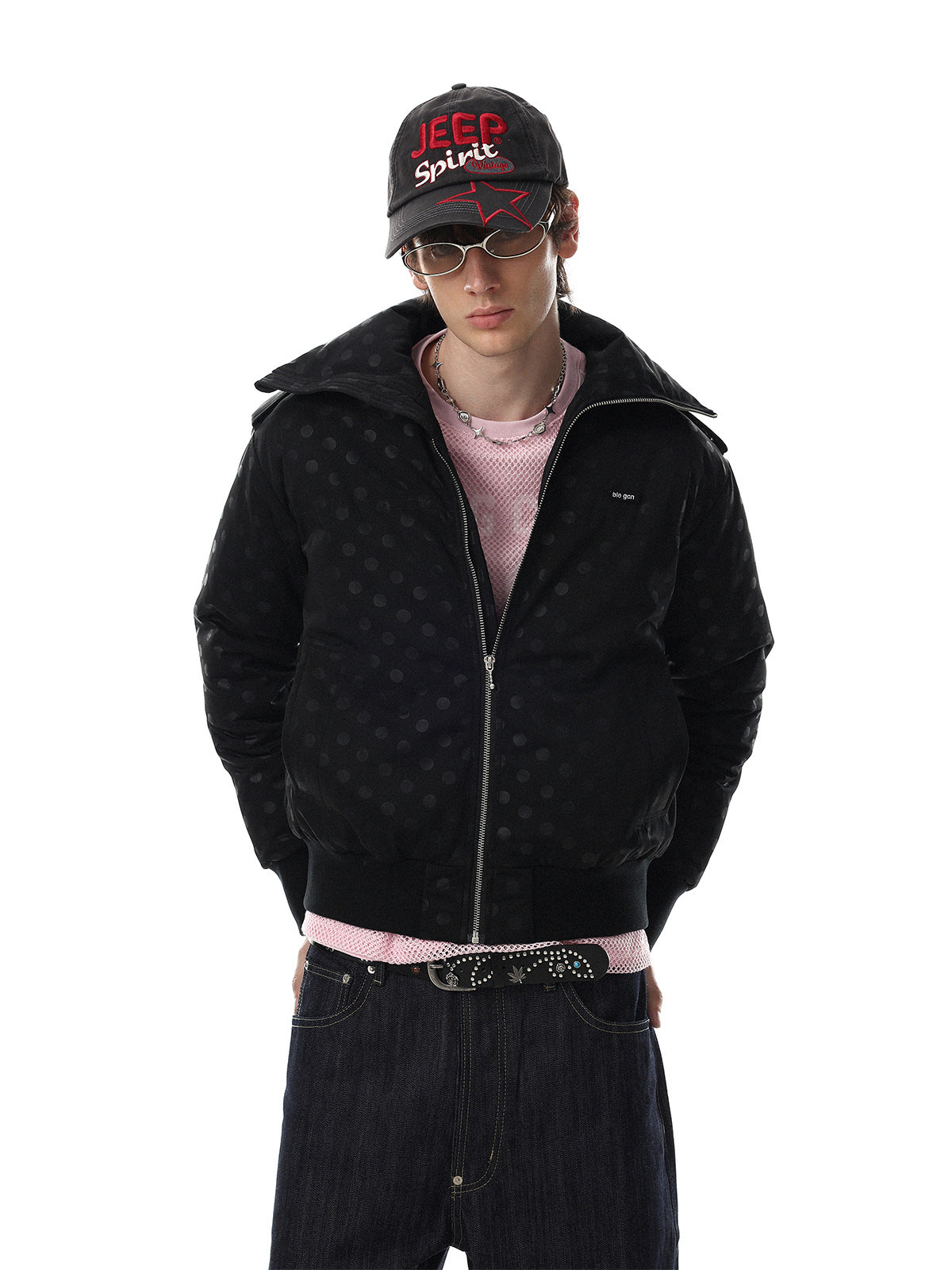 Polka dot padded bomber jacket with oversized collar in black, worn with wide-leg jeans and a pink mesh top