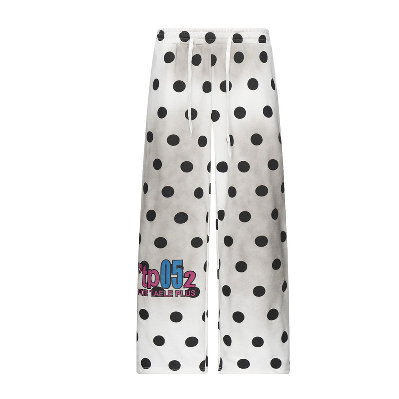 Pantalon de survêtement blanc délavé à l’acide, coupe large, imprimé pois noirs et taille à cordon, vue de face