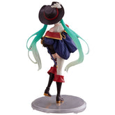 The image shows the "Hatsune Miku Puss in Boots Fairy Tale 18cm PVC Figure," featuring Hatsune Miku with long teal hair, a large black hat with a feather, a cape, thigh-high boots, and corset-style attire. It stands on a circular base and evokes an adventurous mystery reminiscent of Puss in Boots.