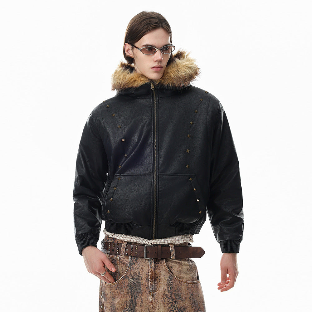 Oversized black PU leather hooded bomber jacket with bronze pyramid studs and faux fur trim collar