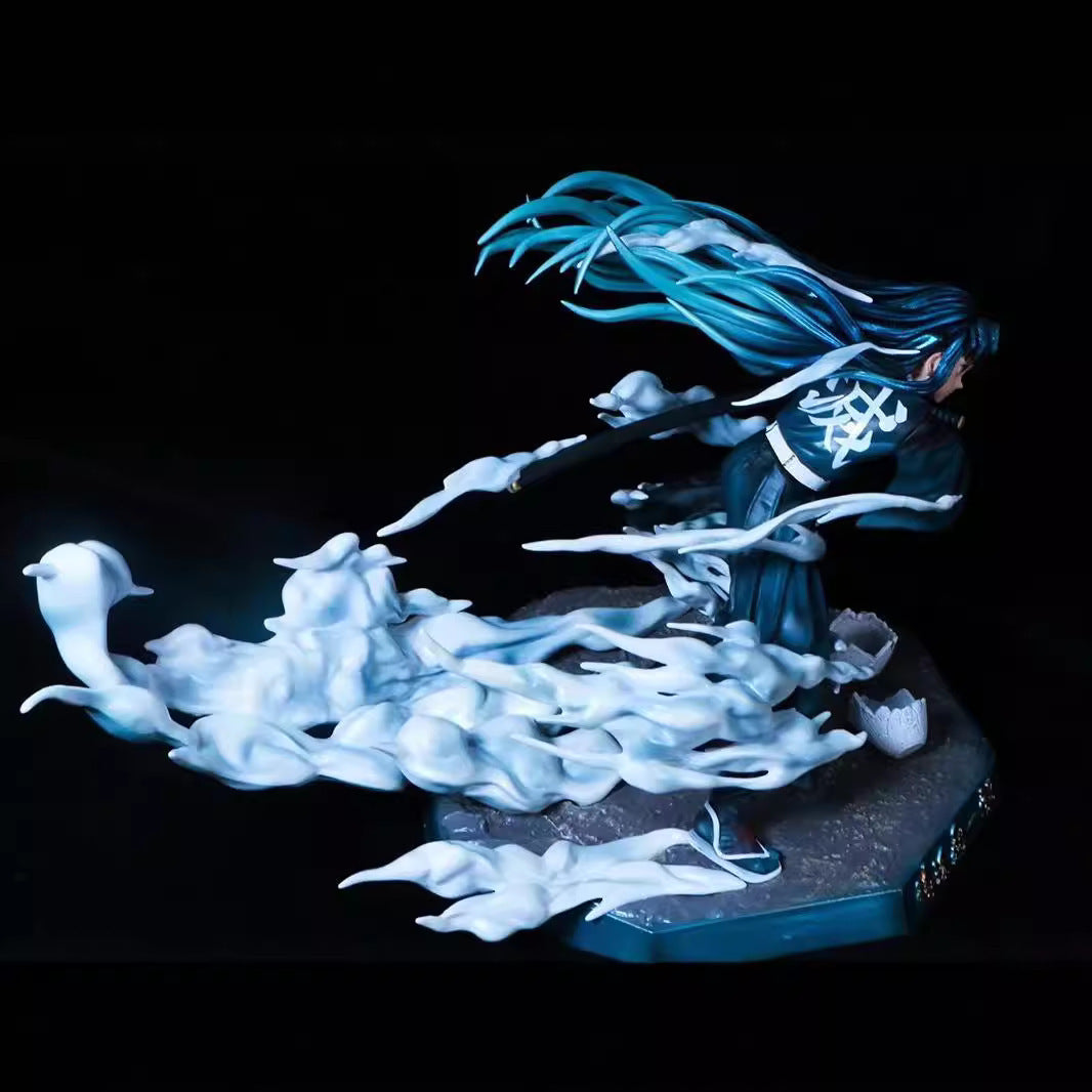 The 18cm Muichiro Tokito Demon Slayer Figure from the Mist Hashira series features long blue hair flowing backward, surrounded by ghost-like white swirls. Wearing black and standing on a dark base, it captures dynamic movement like the Mist Breathing techniques in this premium PVC collectible.