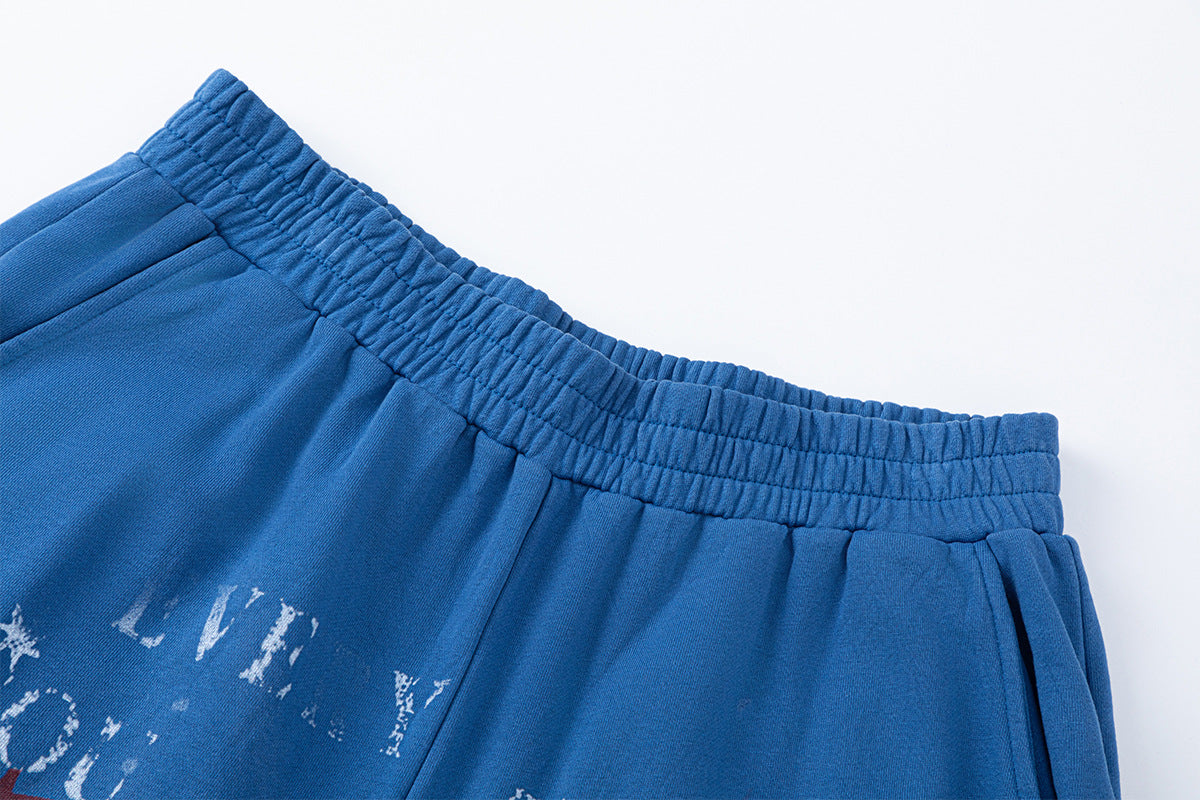 Pantalon de survêtement à jambes larges avec motif d’étoiles et de lettres, coupe décontractée délavée