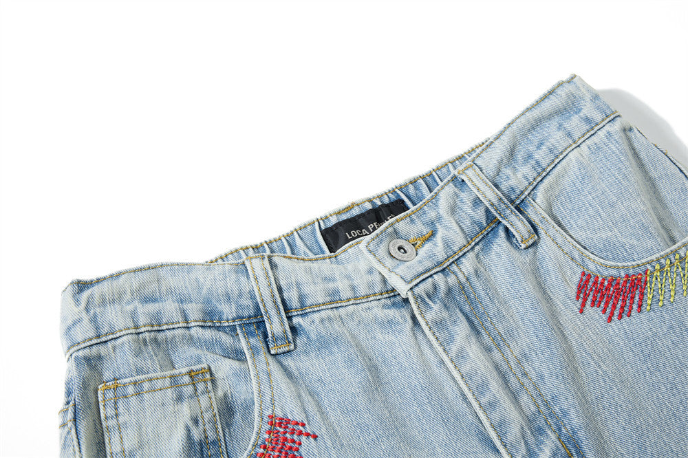 Wide-Leg Washed Denim Jeans with Cross Star Embroidery & Rhinestone Pocket