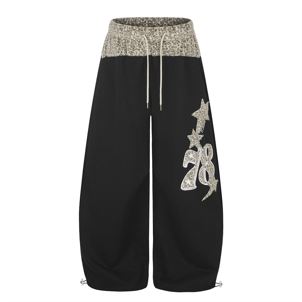Men's wide-leg sweatpants with leopard-print waistband and star patch embroidery in black
