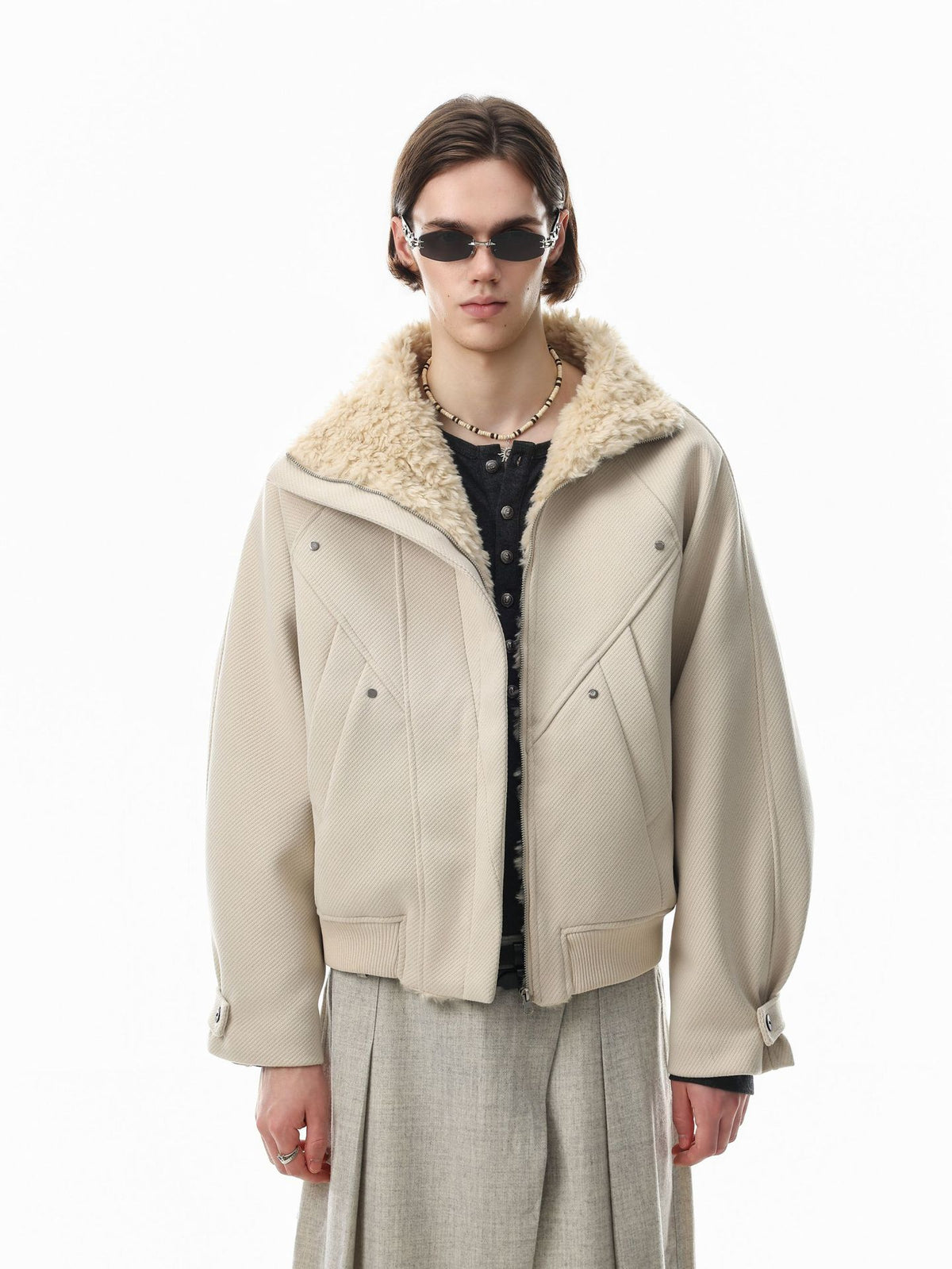 Men's oversized padded bomber jacket with sherpa fleece collar and geometric seam detailing in beige