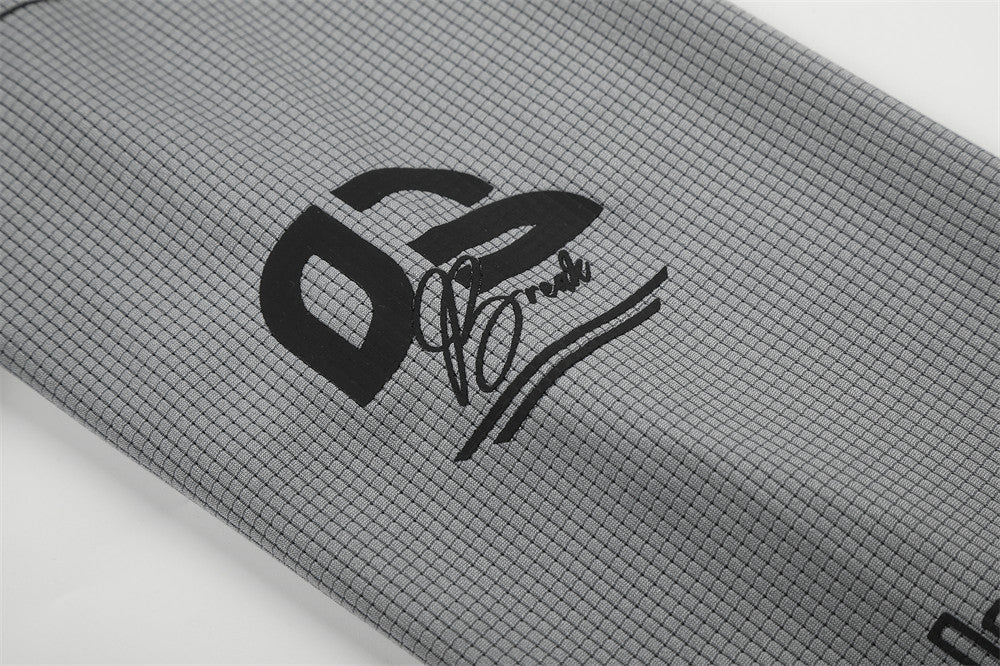 Close-up of gray sleeve graphic with bold 02 logo and script print
