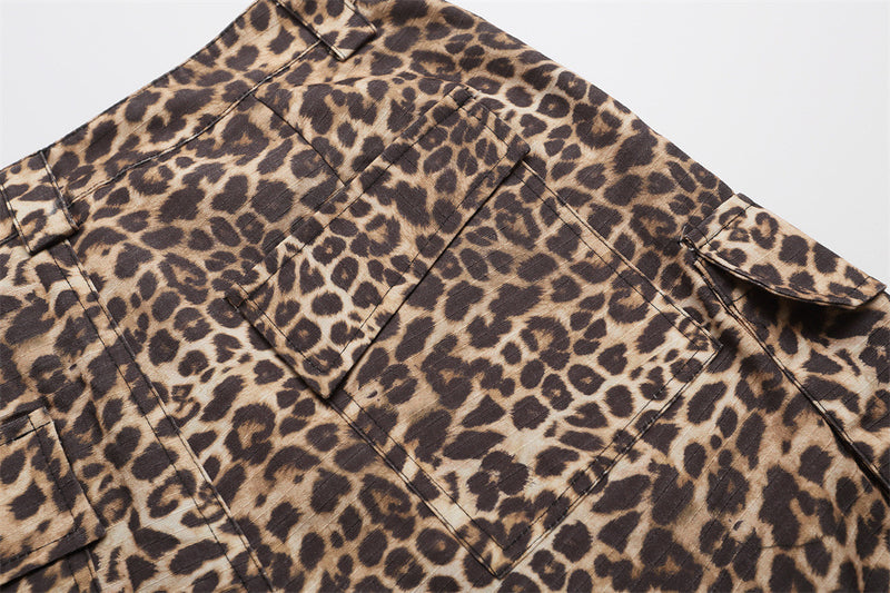 Close-up of leopard print shorts back pocket flap and waistband with side cargo pocket