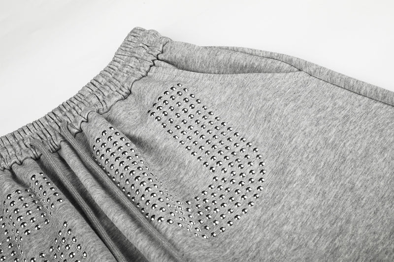 Pantalon de survêtement à jambes larges avec motif FU en strass et délavage vintage