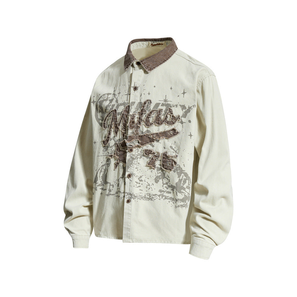 Cream long sleeve button-up shirt with distressed vintage graphic, angled front view