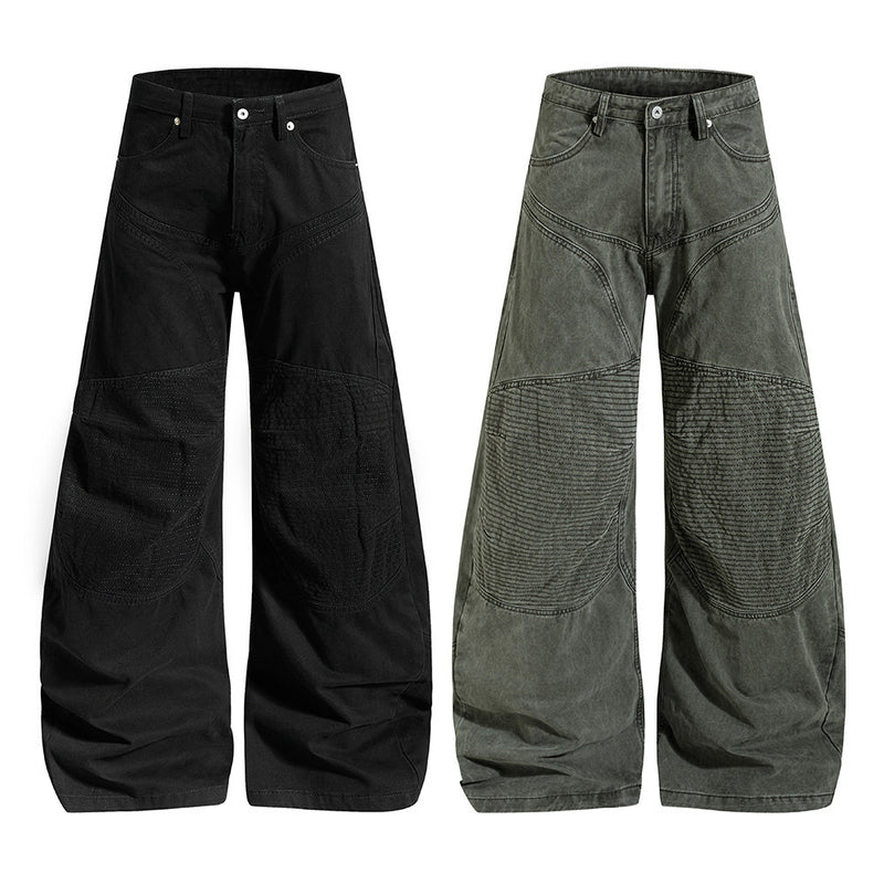 Men's wide-leg deconstructed patchwork pants with arc seams in black and army green, baggy fit streetwear style