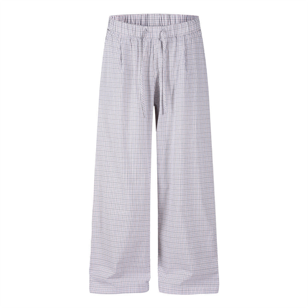 Men's relaxed wide-leg plaid trousers in muted pink grid check with elastic waist and front pleats, front and back view
