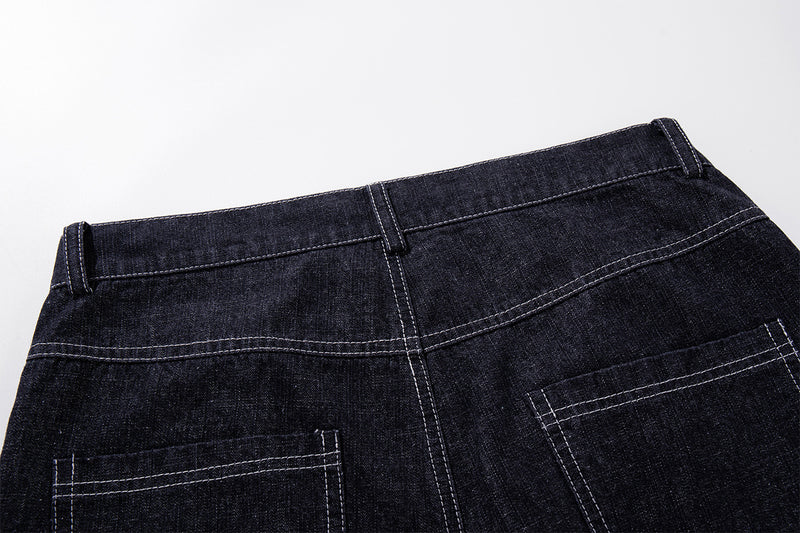 Vaqueros baggy de pierna ancha, lavado oscuro, bragueta diagonal de botones y denim crudo