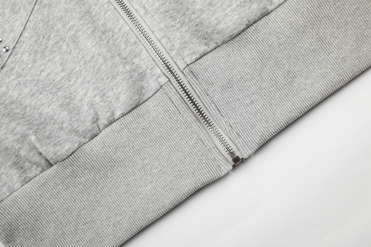 Sweat à capuche zippé avec écusson croix clouté et doublure camouflage