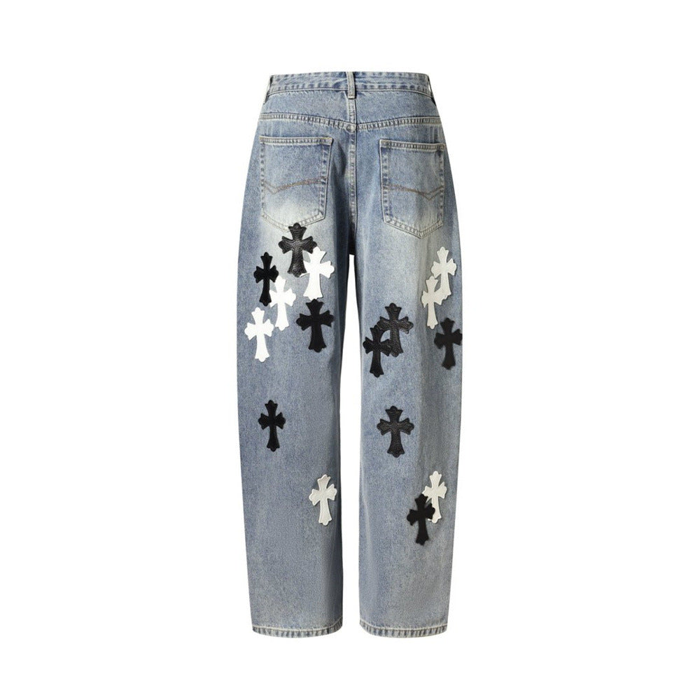 Light wash baggy jeans with cross patches, back view