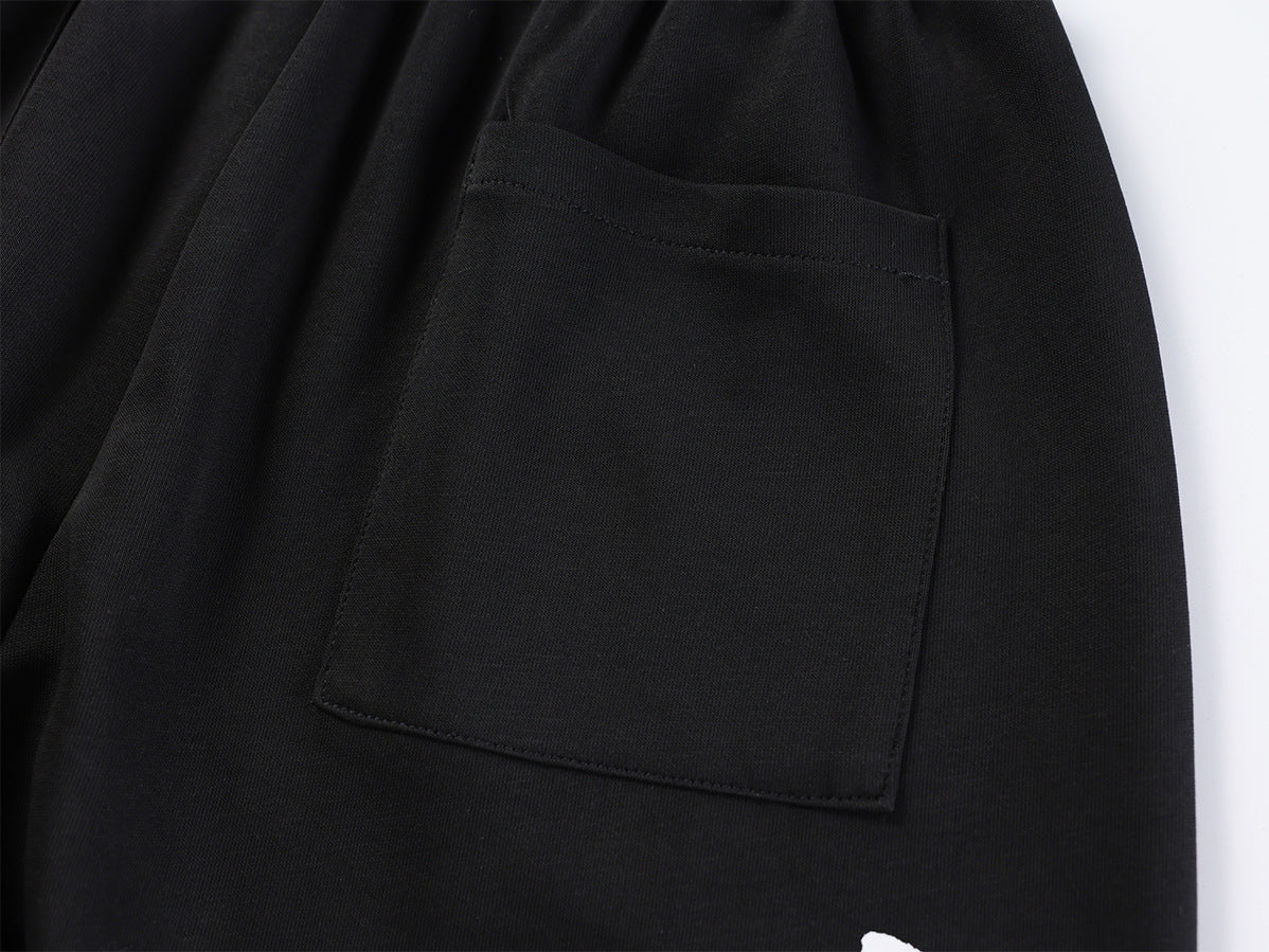 Pantalon de survêtement à jambes larges avec imprimé graffiti cursif et ceinture élastiquée siglée