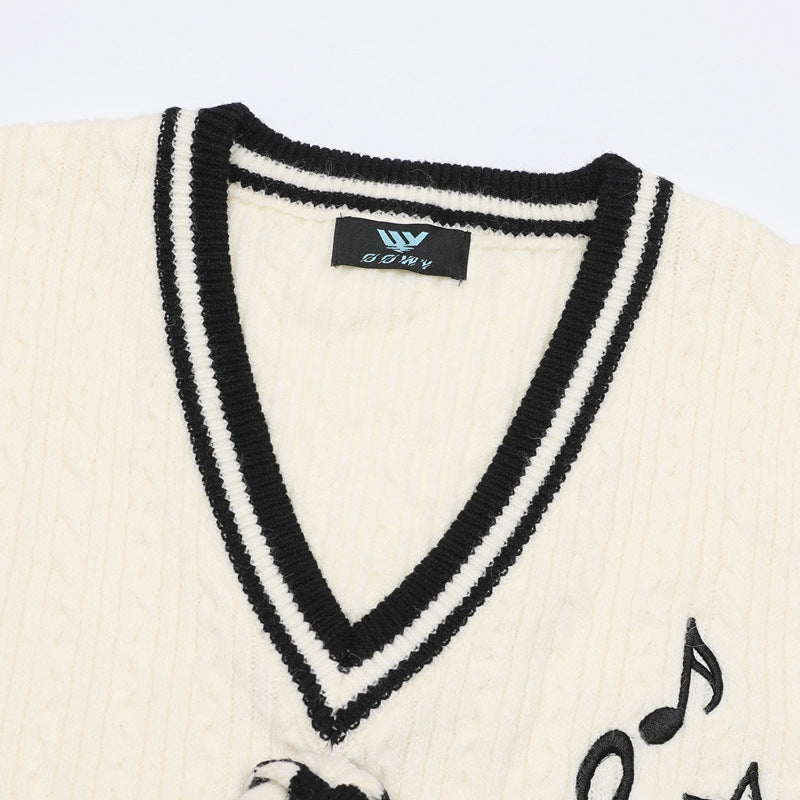 V-Neck Cable Knit Sweater Vest with Music Note Embroidery & Striped Tie Detail