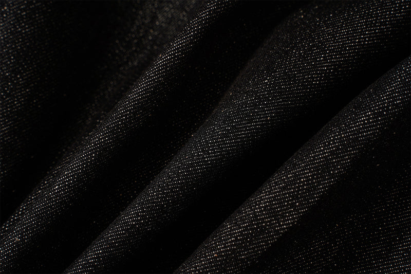Veste en denim noir à devant plissé, fermetures à agrafes métalliques et clous turquoise