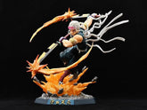 The Premium Demon Slayer Urogi Figure, a 37cm high-quality GK model by Demon Slayer, depicts a warrior with dual swords and fiery effects. It features intricate battle gear, flowing accessories, a black backdrop, and USB light-up effects for added drama.